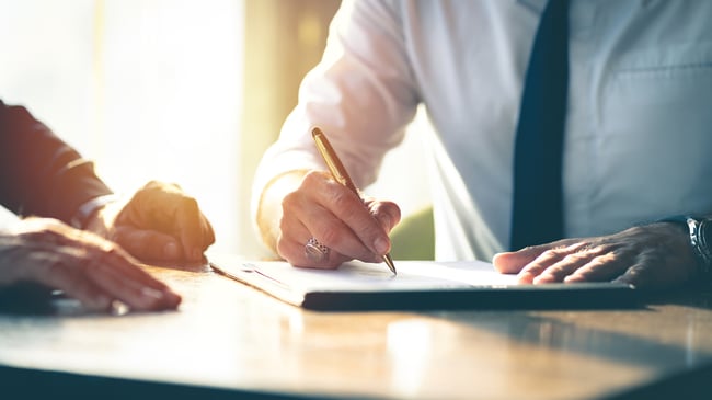 business person signing contract closed sale | Funnel Clarity
