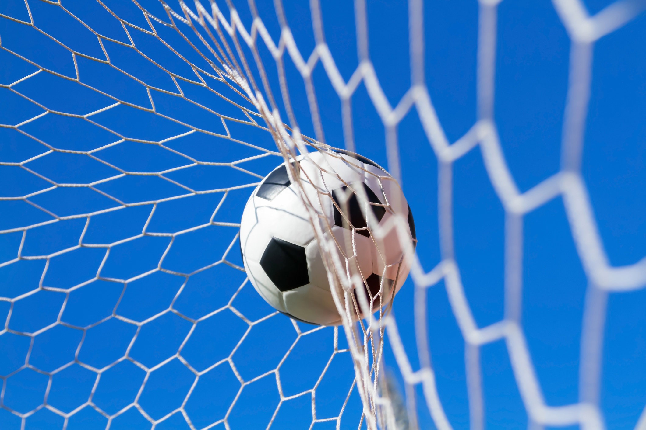 soccer ball scoring a goal in net