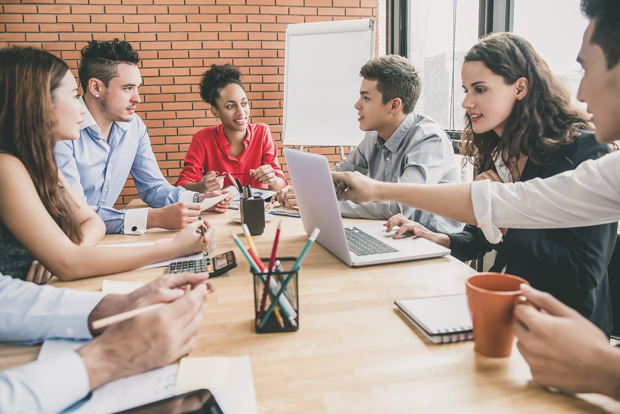 sales people engaged in a meeting in a conference room